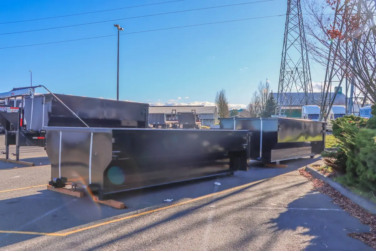 Roll-off dumpster ready for waste disposal at job site for Concrete Dumpster Rental in Madison